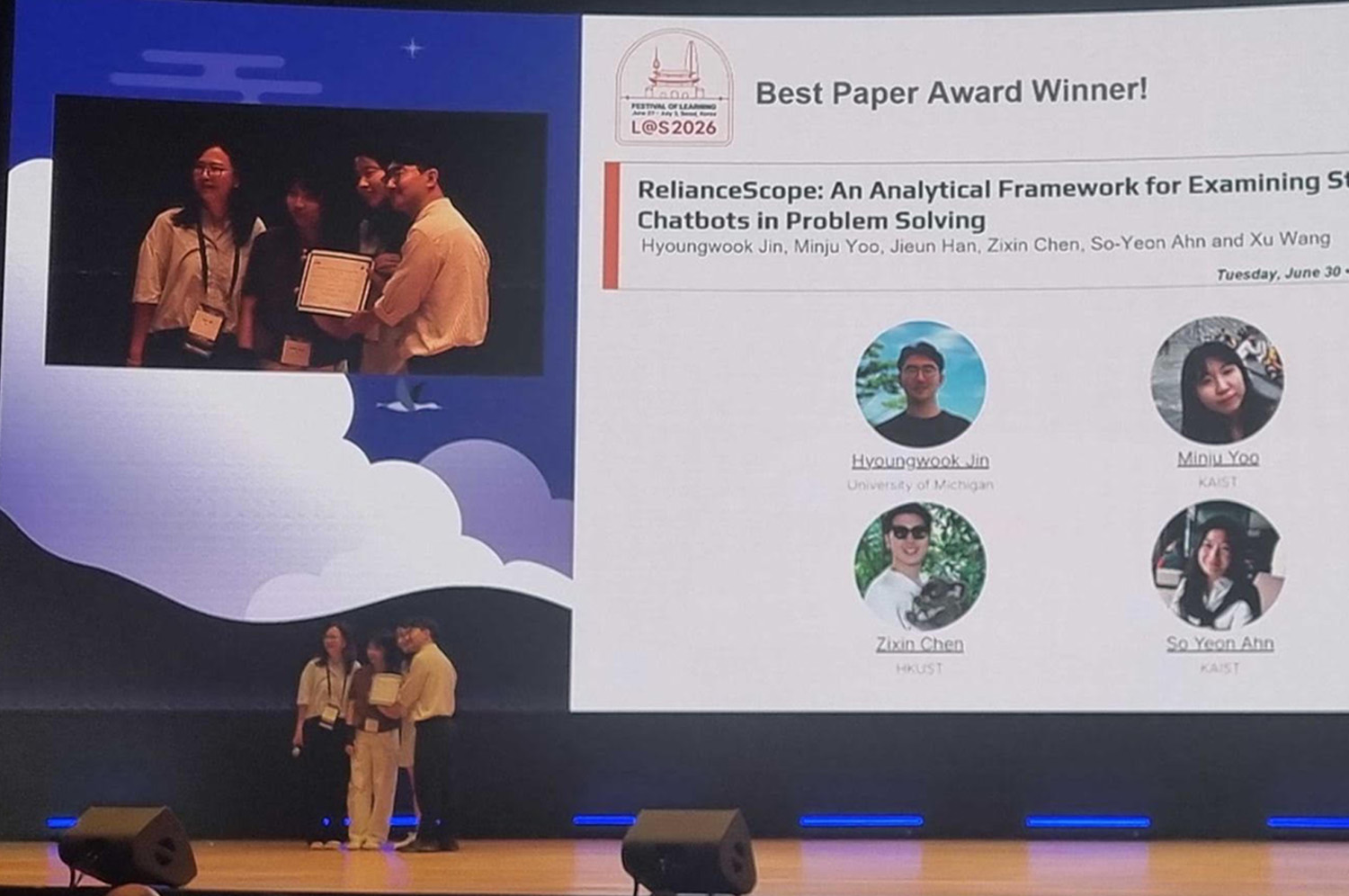 Students accept an award on stage