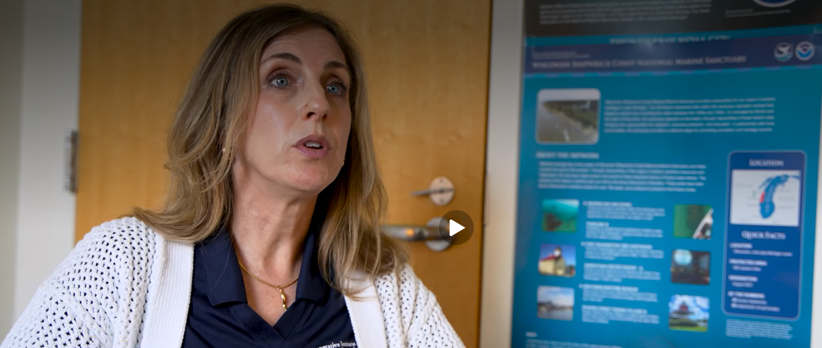 A woman can be seen talking.